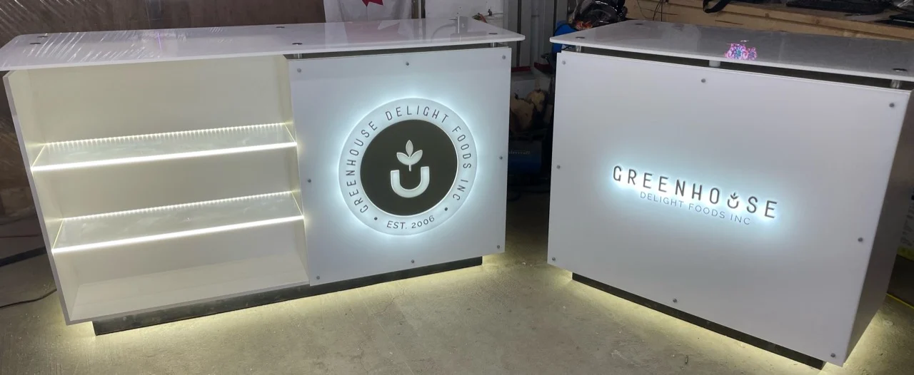 Westcoast CNC custom white trade-show cabinetry with illuminated branding
